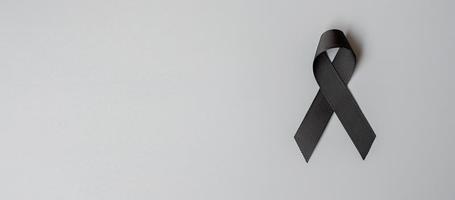 Black mourning ribbon with a dark background. AI Generated 23978368 Stock  Photo at Vecteezy