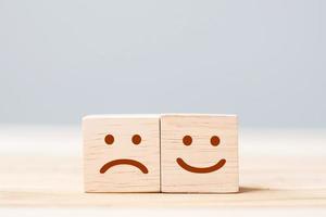 emotion face symbol on wooden cube blocks. Service rating, ranking, customer review, satisfaction and feedback concept photo