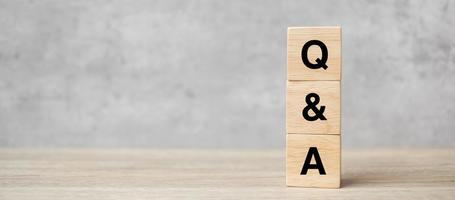 Q and A word with wooden block. FAQ frequency asked questions, Answer, Question  Ask, Information, Communication and Brainstorming Concepts photo