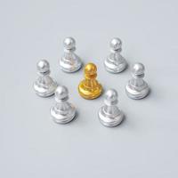 golden chess pawn pieces or leader  leader businessman with circle of silver men. leadership, business, team, and teamwork concept photo