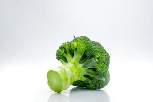 Green broccoli Brassica oleracea. Vegetables natural source of betacarotene, vitamin c, vitamin k, fiber food, folate. Fresh broccoli cabbage isolated on white background. photo