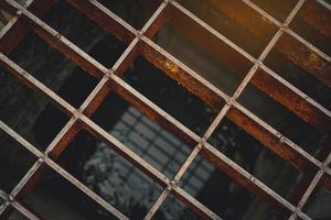 Top view of old and rusty metal covered on street drain hose. Rust metal texture background. Salt water accelerates rust. Surface of Metal in construction site near the sea. photo