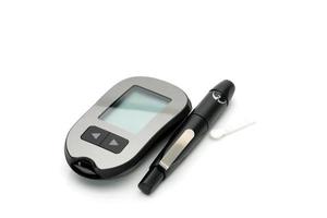 Medical equipment for measuring the level of blood glucose with lancing pen device on white background with copy space photo