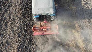 Tractor plowing in paddy field video