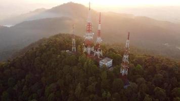 Aerial fly over four telecommunication tower