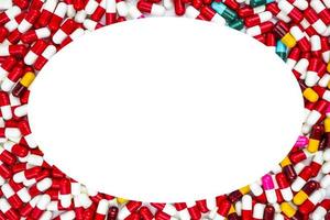 Colorful of antibiotics capsule pills oval frame on white background with copy space. Drug resistance concept. Antibiotics drug use with reasonable and global healthcare concept. photo