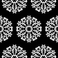 White round lace patterns on a black background. Beautiful seamless background with floral mandalas. Black and white. Vector vintage round ornament.