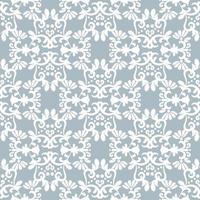 White ornament on light blue background. Floral damask seamless pattern. Vector winter background. For fabric, wallpaper or packaging.