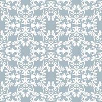 White ornament on light blue background. Floral damask seamless pattern. Vector winter background. For fabric, wallpaper or packaging.