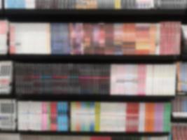 Blurred of Books arranged on shelves, bookshelf in the shop or library, background photo