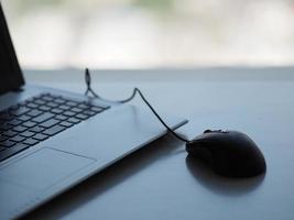 notebook with mouse on the table photo