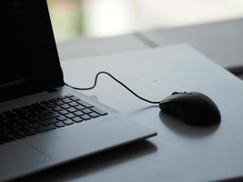 notebook with mouse on the table photo