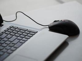 notebook with mouse on the table photo