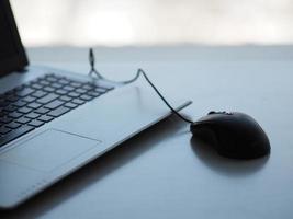 notebook with mouse on the table photo