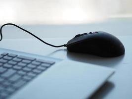 notebook with mouse on the table photo