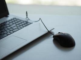 notebook with mouse on the table photo