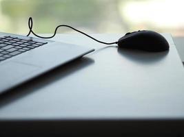 notebook with mouse on the table photo