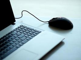 notebook with mouse on the table photo