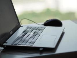 notebook with mouse on the table photo
