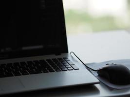 notebook with mouse on the table photo