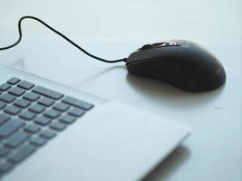 notebook with mouse on the table photo