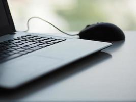 notebook with mouse on the table photo