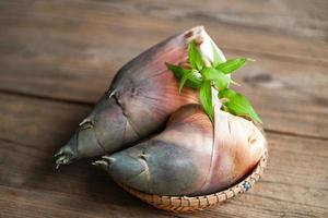 Bamboo shoots on wooden table background, Fresh raw bamboo shoot for cooking food in thailand photo