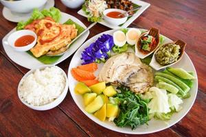 thai food top view asian food served on wooden table setting with plate menu in thailand photo