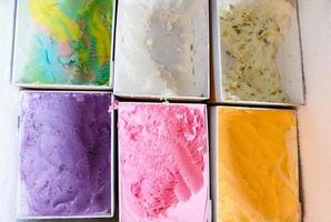ice cream scoop, colorful ice cream in box photo