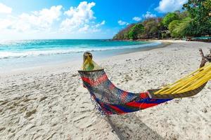 View of beautiful tropical landscape beach sea island with ocean blue sky background in Thailand summer beach vacation relax - Beach hammock on sand sea waves water and coast seascape photo