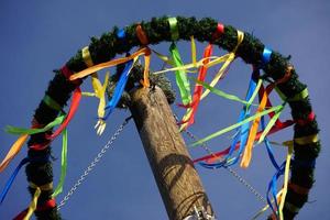 Colorful Ribbons And Beautiful Blue Sky. Maypole Set Up. photo