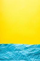Minimalist paper background in blue and yellow. photo