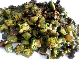 Indian style Masala Sabji OR Sabzi of fried Bhindi OR Okra also known as Ladyfinger photo