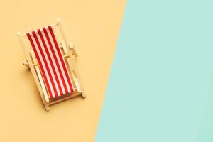 Summer holiday concept. Top view of beach deck chair with space for text photo