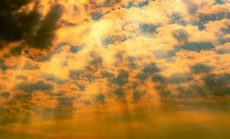 God light. Dramatic dark cloudy sky with sun beam. Yellow sun rays through dark and white clouds. God light from heaven for hope and faithful concept. Believe in god. Beautiful sunlight sky background photo