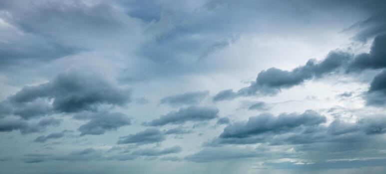 Dark dramatic sky and clouds. Background for death and sad concept. Gray sky and fluffy white clouds. Thunder and storm sky. Sad and moody sky. Nature background. Dead abstract background. Cloudscape. photo