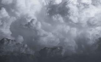 Dark dramatic sky and clouds. Background for death and sad concept. Gray sky and fluffy white clouds. Thunder and storm sky. Sad and moody sky. Nature background. Dead abstract background. Cloudscape. photo