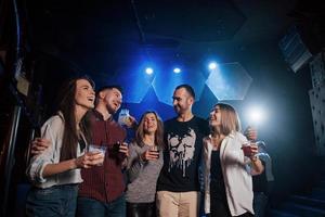 Finally weekend. Beautiful youth have party together with alcohol in the nightclub photo