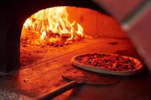 Natural fireplace. Fire burning in the furnace. Close up view of wood in flames photo