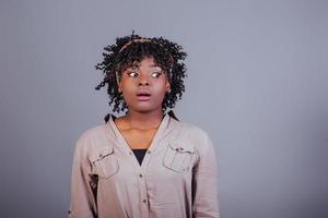 Exams is coming. Attractive afro american woman in casual clothes in the studio photo