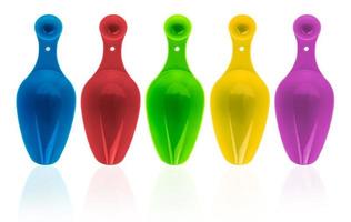 Set of colorful plastic measuring spoon isolated on white background with shadow. Blue, red, green, yellow, and purple plastic measuring spoon. photo