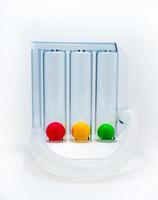 Device for exercising respiration through deep inspiration triple chamber. Medical equipment for respiratory therapy after surgery. Deep Breathing lung exerciser. Breath Measurement. 3 color balls. photo