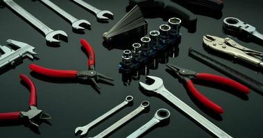Set of mechanic tools. Chrome wrenches or spanners, hexagon socket, end cutter pliers, locking pliers, vernier caliper, pincers, feeler gauge, and tape measure. Chrome vanadium spanner wrench. photo