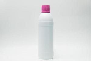 White plastic bottle with pink cap isolated on white background with copy space and blank label. Cleaning products container. Bathroom cleaner bottle.  Household Chemical bottle for cleaning toilet. photo