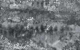 Black and gray dirty concrete wall texture background. Dark grunge concrete wall texture background. Rough cement surface abstract background. The unique crack pattern of old and dirty cement floor. photo