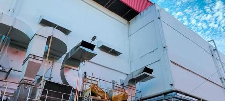 Air flow system of factory. Industrial ventilation. Air flow system of manufacturing building. Stainless steel pipe of ventilation system. Plant factory airflow of cooling system. Air Handling Unit. photo
