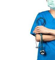 Surgeon doctor wear blue scrubs shirt uniform and green face mask. Physician stand with arms crossed and hand holding stethoscope. Healthcare professional. Surgeon doctor stand with confidence. Trust. photo