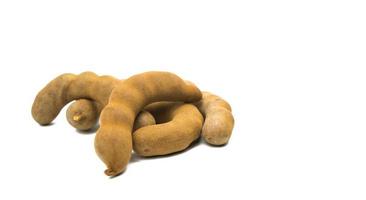 Tamarind - Sweet ripe tamarind  isolated on  white background with clipping path. Use for advertising concept of tamarind juice. Copy space photo