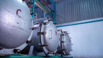 High pressure processing or high hydrostatic pressure machine for food product. Metal tank in food manufacturing factory. Food preservation by pasteurizing in high pressure processing to pathogen free photo