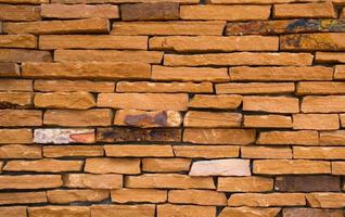 Orange brick wall texture background with space for text photo